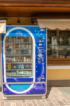15 July 2026, Alleghe, Italy. Durex condom vending machine outside a pharmacy in an Alpine village