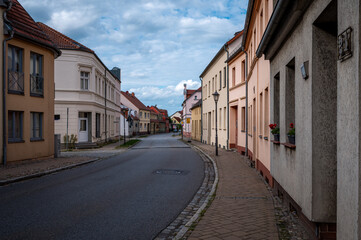 Fototapeta premium Historic street with traditional houses in Kremmen, Brandenburg, Germany