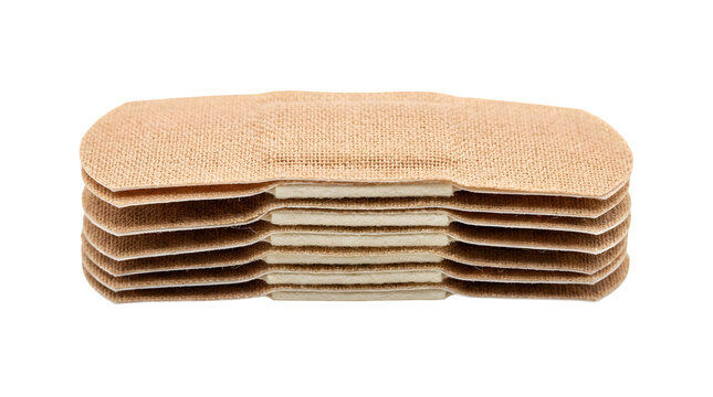 Stack of beige adhesive bandages isolated on transparent background