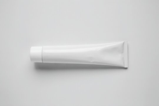 Blank white cosmetic tube for cream or toothpaste isolated on white background