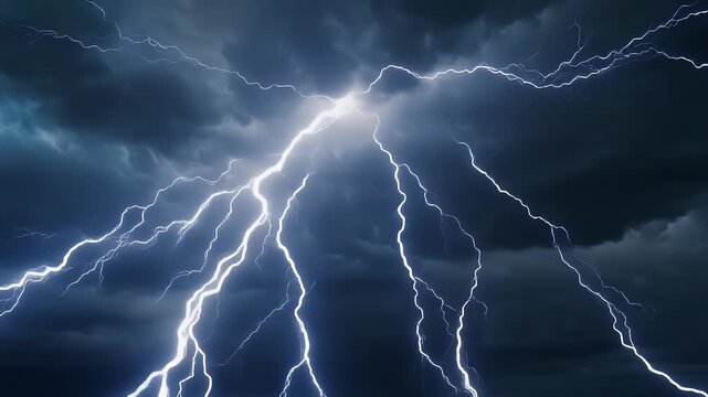 A dramatic bolt of lightning illuminates a dark, stormy sky with jagged branches of electricity.
