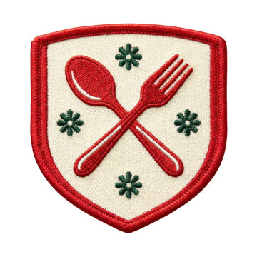 Embroidered shield patch with crossed spoon and fork and green floral accents isolated on transparent background