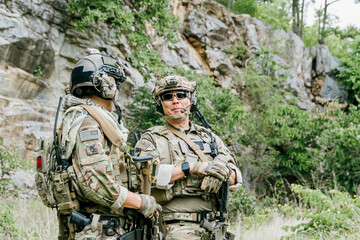 Fototapeta premium Outdoor soldiers jungle soldiers soldiers duty alert concentrated focused determined watchful professional tactical military combat patrol mission