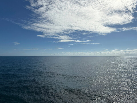 Open sea blue shiny water and beautiful sky