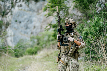 Naklejka premium Focused brave outdoor soldiers in jungle patrol on duty look alert with intense facial expression during tactical field operation mission