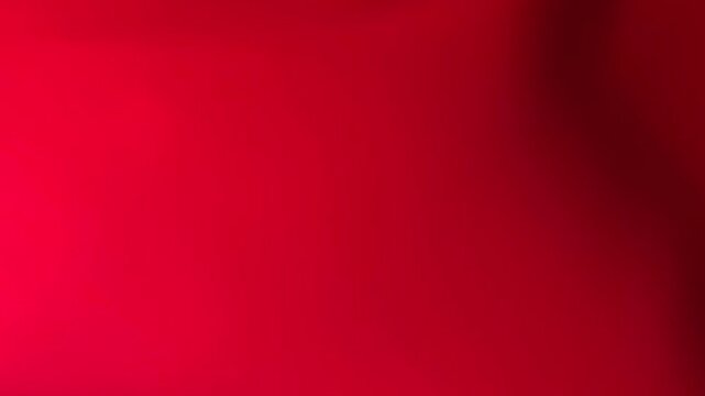 Horizontal abstract red background featuring glowing light leaks, lens flares, and bokeh effects.