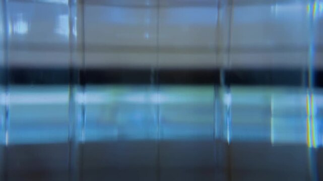 Abstract light leaks create a background with dynamic blue flashes, ideal for technological and futuristic concepts.