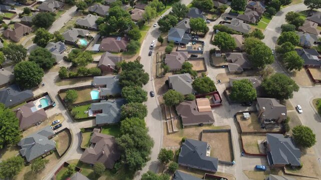 Single-family residences align along quiet subdivision streets in Mesa Verde across DFW metroplex. Private backyards, in-ground swimming pools illustrate serene suburban living, DeSoto, Texas
