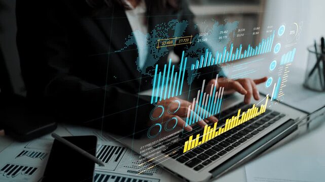 Professional businesswoman working on laptop with financial graphs and data analysis overlay, focusing on market trends and statistics for informed decisions. Entropy.