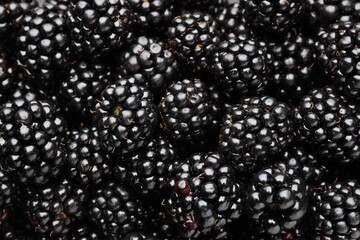 Heap of ripe tasty blackberries as background, closeup © New Africa
