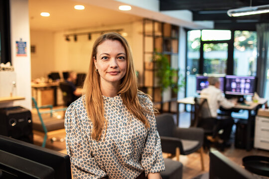 Confident businesswoman portrait in modern coworking office