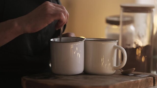 Woman Prepares And Stirs A Hot Cocoa Drink With A Spoon