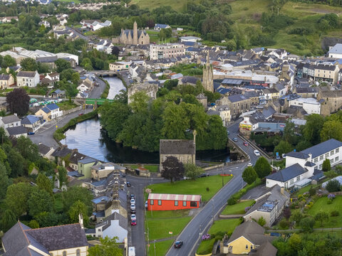 Aerial view of Donegal town featuring the historic Donegal Castle, the winding River Eske, and surrounding stone buildings and lush green landscape in Donegal, County Donegal, Ireland.