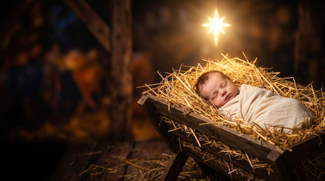 A newborn baby rests in a manger filled with straw. The baby is wrapped in a soft cloth, and a star shines above. The setting is dark, resembling a stable