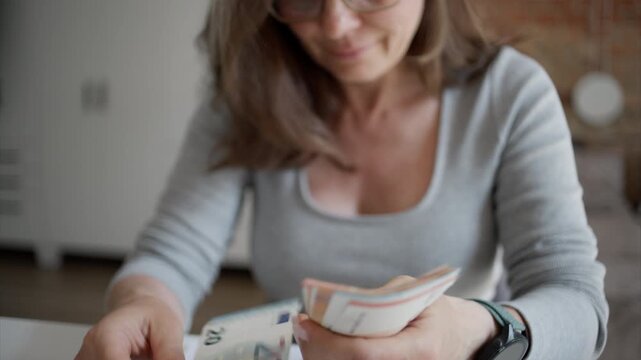 Woman Managing Family Budget Counting Euro Bills