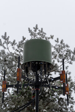 Tactical electronic warfare or communication antenna mounted on a tripod in snow