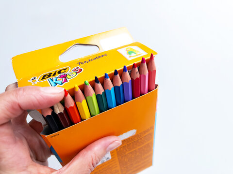 OMSK, RUSSIA - APRIL 02, 2026: Hand Holding Open Pack of Bic Colored Pencils