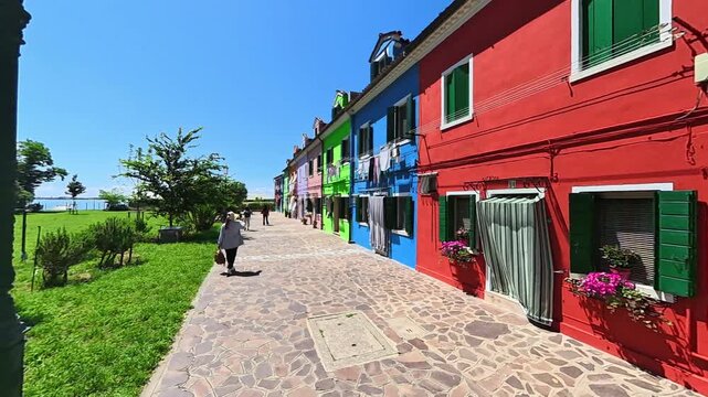 Colorful Street with Venetian Houses and Hanging Laundry in Burano Italy