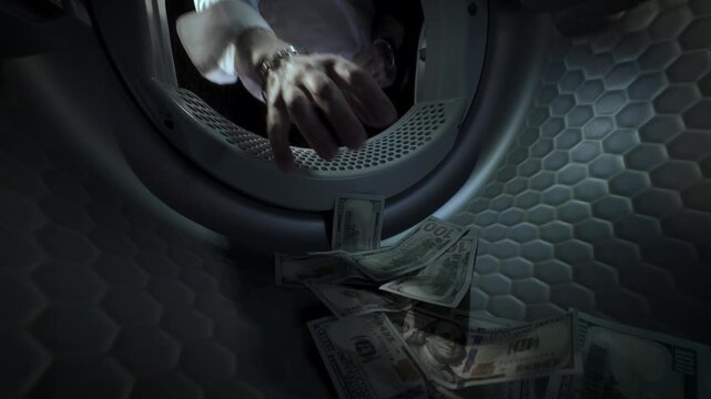 Conceptual video of a Caucasian man wearing a white shirt placing US dollar banknotes in a washing machine with his hands and taking them out in slow motion. Money laundering.