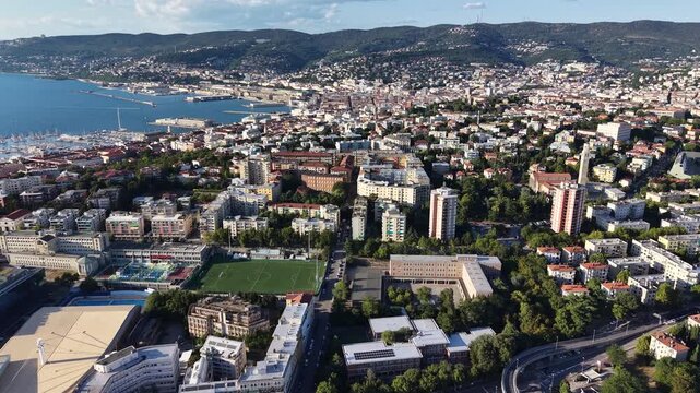 Panoramic drone shot of Trieste city skyline and Adriatic coastline, Italy