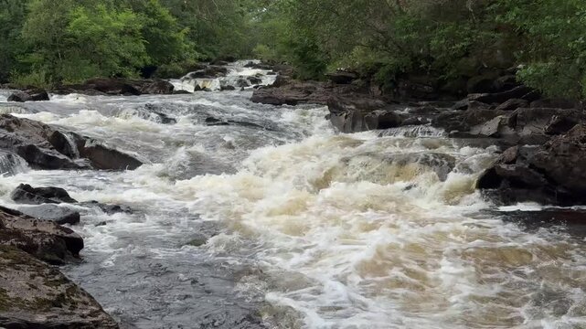 Heavy flowing river with cascades in Northern Scotland's highlands