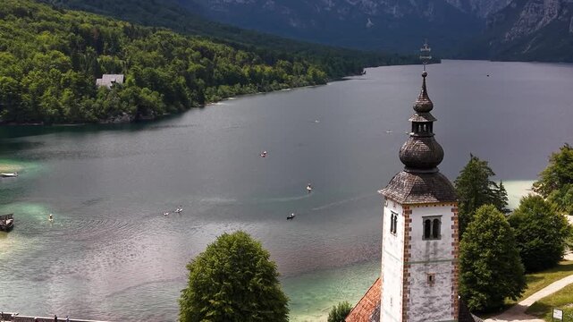 Drone view of Lake Bohinj and St John the Baptist Church, Slovenia