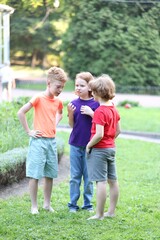 Fototapeta premium Little friends spending time together on green grass outdoors