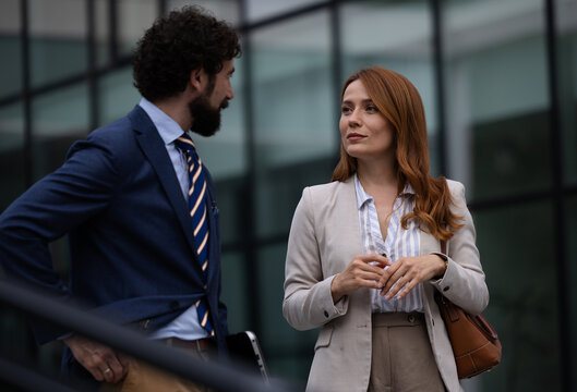 Business meeting outside a modern building
