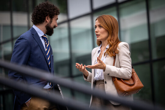 Business meeting outside a modern building