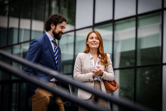 Business meeting outside a modern building