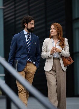 Business meeting outside a modern building
