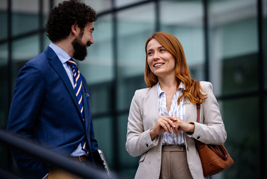 Business meeting outside a modern building