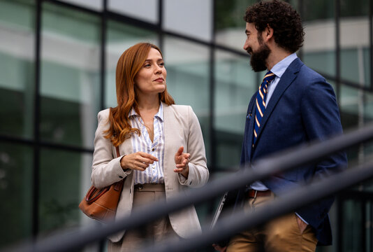 Business meeting outside a modern building