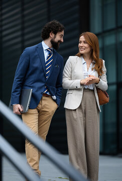 Business meeting outside a modern building
