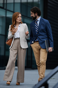 Business meeting outside a modern building