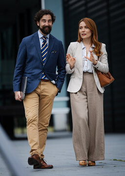 Business meeting outside a modern building