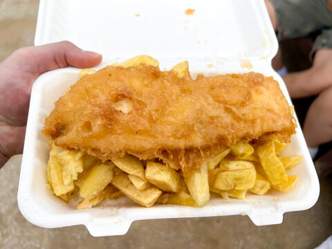Close up view of fish and chips, a traditional British takeaway meal.