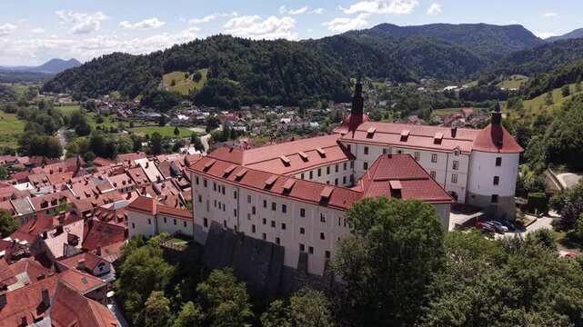 Flight over Skofja Loka Castle (Loski grad) on a hill in Slovenia