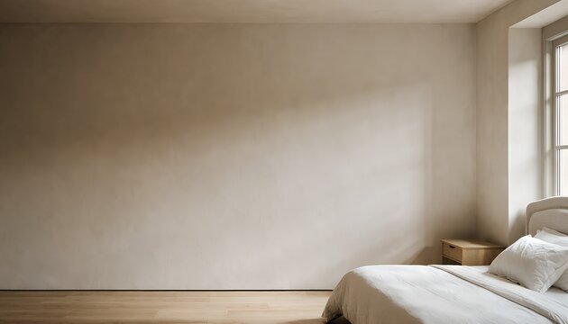 Minimalist bedroom with large blank wall and bed