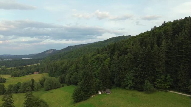 4K Aerial Drone View of Mountain Forest Slopes and Remote Wilderness Cabin Near Zakopane, Poland