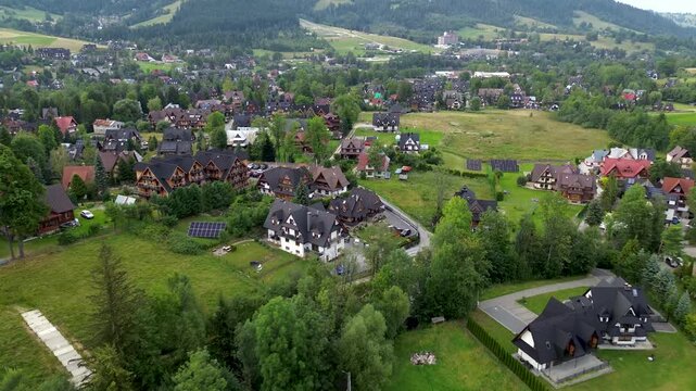 4K Aerial Drone View Over Zakopane Town, Traditional Architecture, and Tatra Foothills, Poland