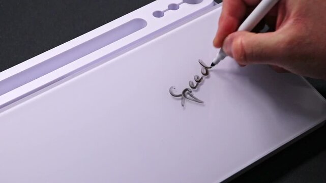 European male hand writing speedy recovery on whiteboard with black pen and erases it with white sponge afterwards for seamless looping message writing on whiteboard. Get well message text.