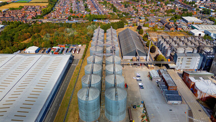 drone aerial view of massive grain silos and warehouses © Андрей Нелупов