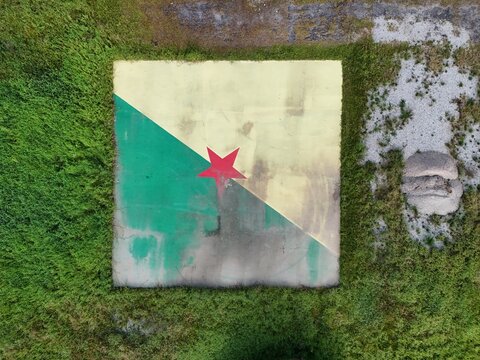 Aerial view of a sports court surrounded by tropical vegetation in Iracoubo, French Guiana.