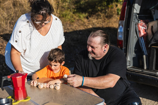Family with prosthetic leg enjoying camping van trip