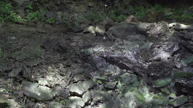 Water hitting rocks in slow motion
