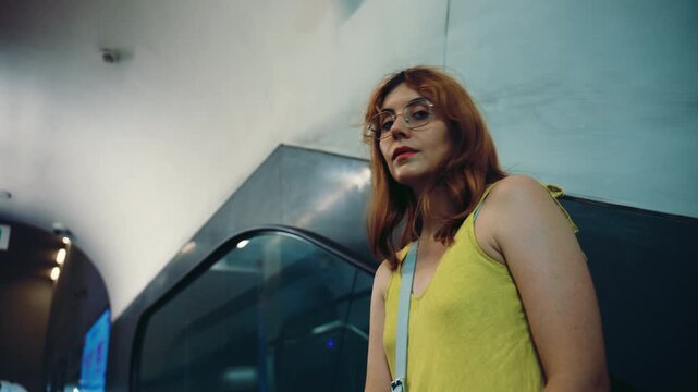 A tourist visits the city of Naples, coming up the metro escalators