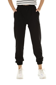 Woman wearing pants in a white studio for e-commerce fashion