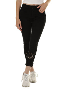 Woman wearing pants in a white studio for e-commerce fashion