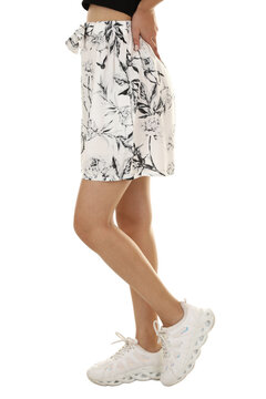 Woman wearing shorts in a white studio for e-commerce fashion